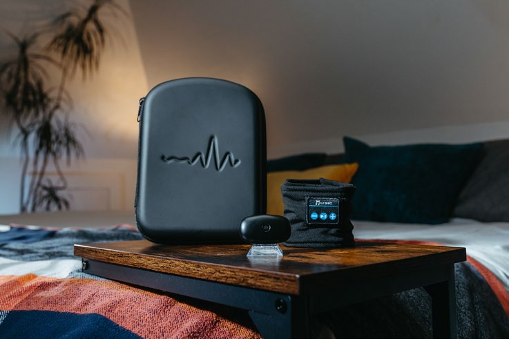 myWaves Pebble device and travel case on a nightstand